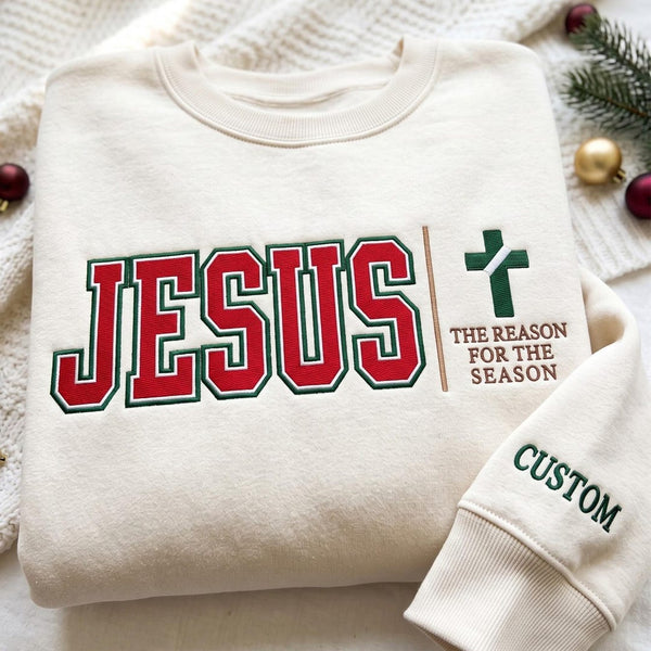 Personalized Jesus the Reason for the Season Varsity Cross Christmas embroidered sweatshirt — front view