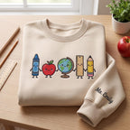 Personalized Teacher Name Crayon Apple Globe Ruler Pencil Holding Hands embroidered sweatshirt — front view