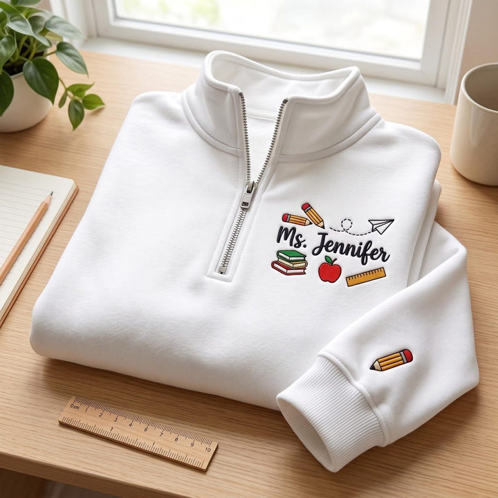 Personalized Teacher Name Apple Books Pencil Ruler Paper Plane embroidered sweatshirt — front view