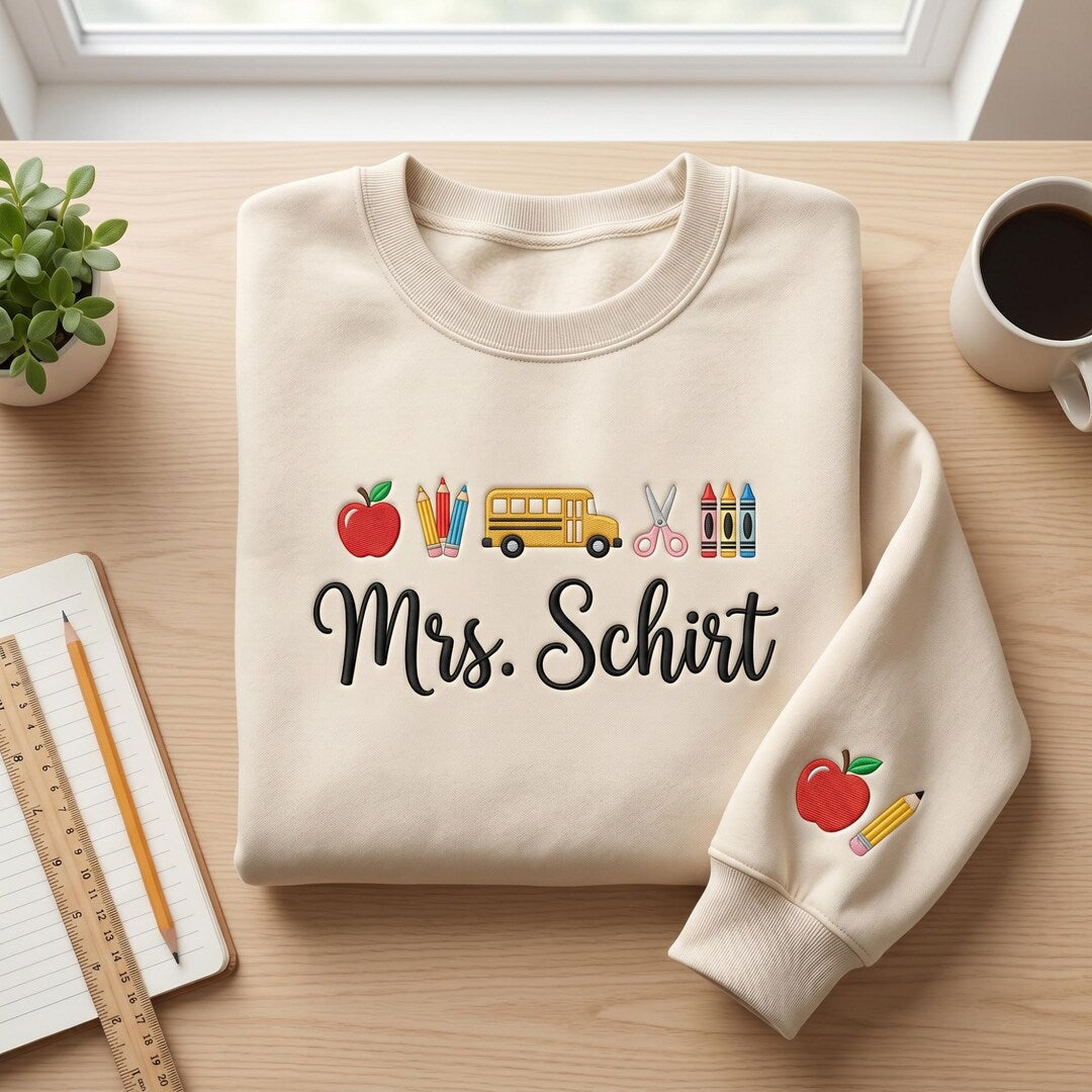 Personalized Teacher Name Apple School Bus Pencils Crayons Scissors Sleeve embroidered sweatshirt — front view
