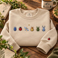 Six Garden Bugs Beetle Ladybug Dragonfly Sleeve Accent embroidered sweatshirt — front view