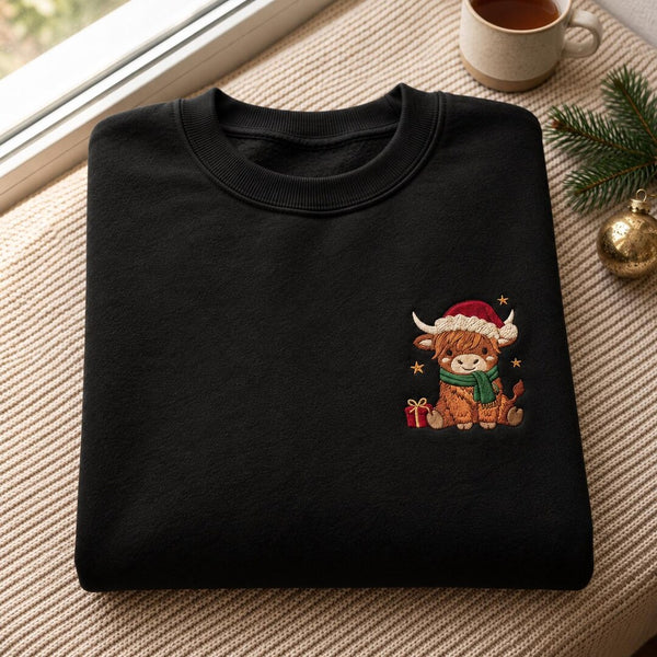 Personalized Christmas Highland Cow Santa Hat Scarf Stars Gift embroidered sweatshirt — front view