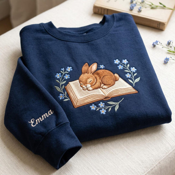 Personalized Sleeping Bunny Reading Book Forget-Me-Not Flowers Custom Sleeve Name embroidered sweatshirt — front view