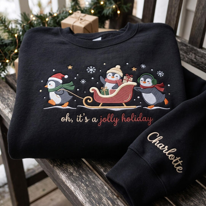 Personalized Christmas Penguins Sleigh Jolly Holiday Custom Name Sleeve embroidered sweatshirt — front view