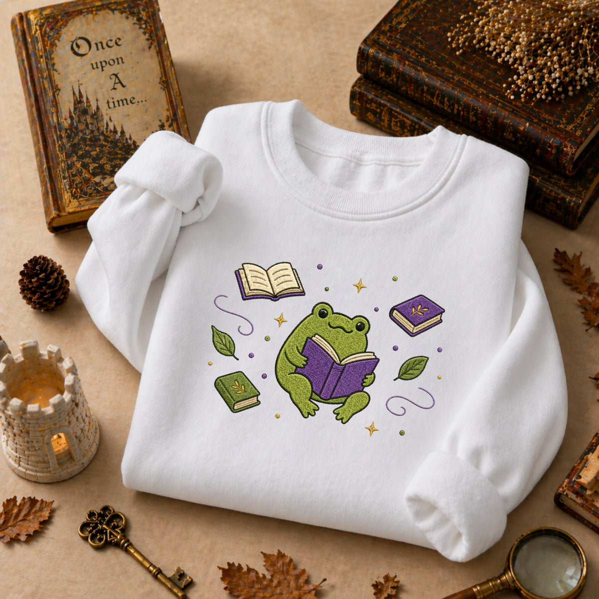 Frog Reading Books Leaves Stars Cottagecore embroidered sweatshirt — front view
