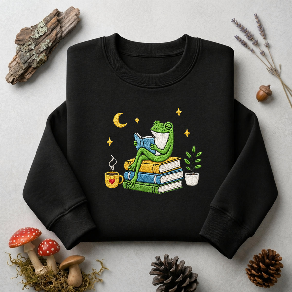 Frog Reading Books Stack Coffee Cup Plant Moon Stars embroidered sweatshirt — front view