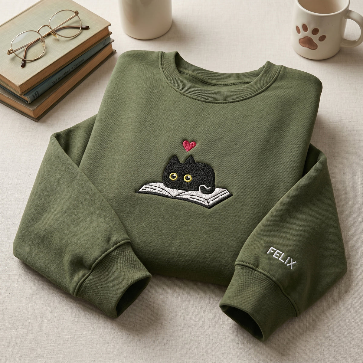 Personalized Black Cat Peeking Over Book Heart embroidered sweatshirt — front view