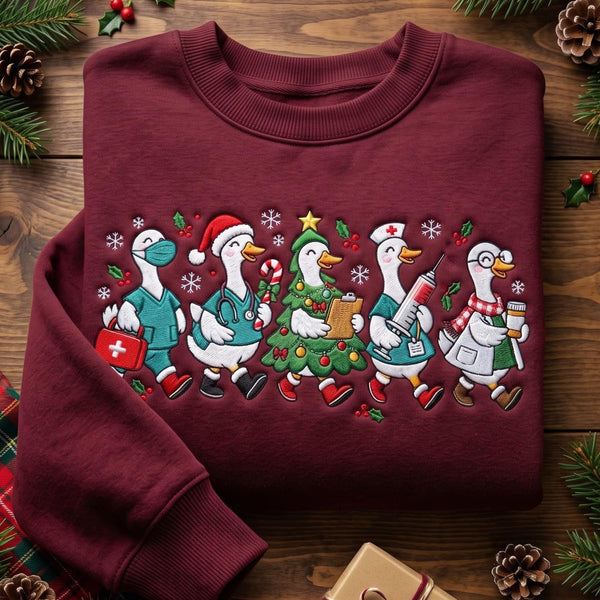 Personalized Christmas Nurse Geese Squad Scrubs Santa Hat Candy Cane Tree Custom Name embroidered sweatshirt — front view