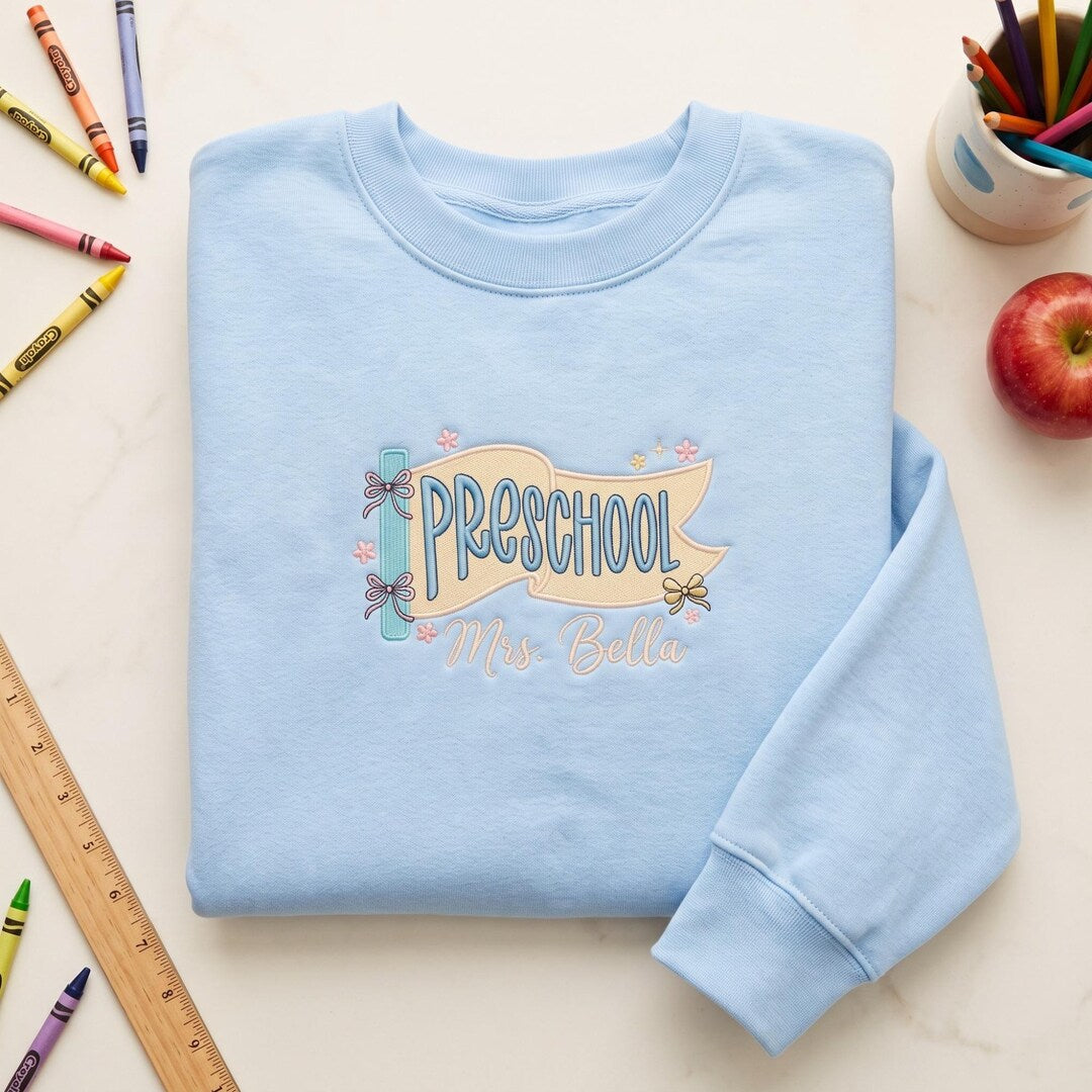 Personalized Preschool Teacher Pennant Banner Bow Floral Custom Name embroidered sweatshirt — front view