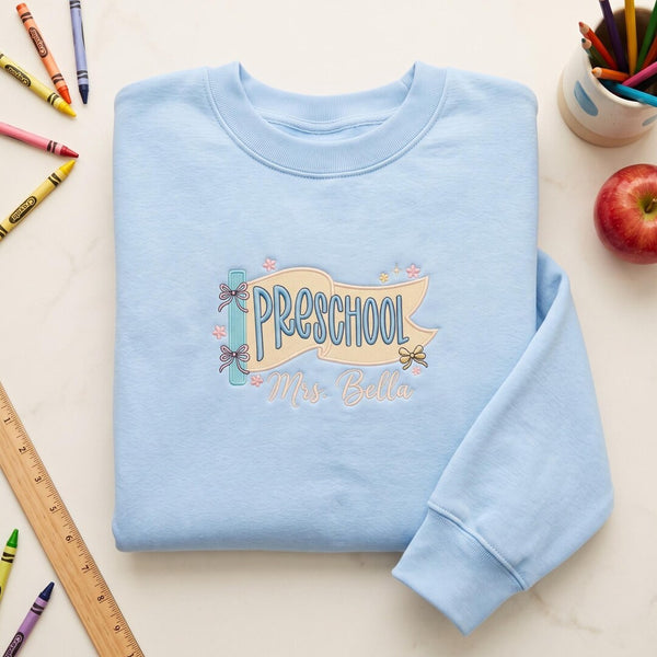 Personalized Preschool Teacher Pennant Banner Bow Floral Custom Name embroidered sweatshirt — front view