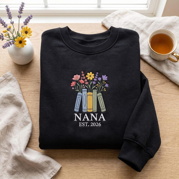 Personalized Nana EST 2026 Wildflower Books Bouquet embroidered sweatshirt — front view