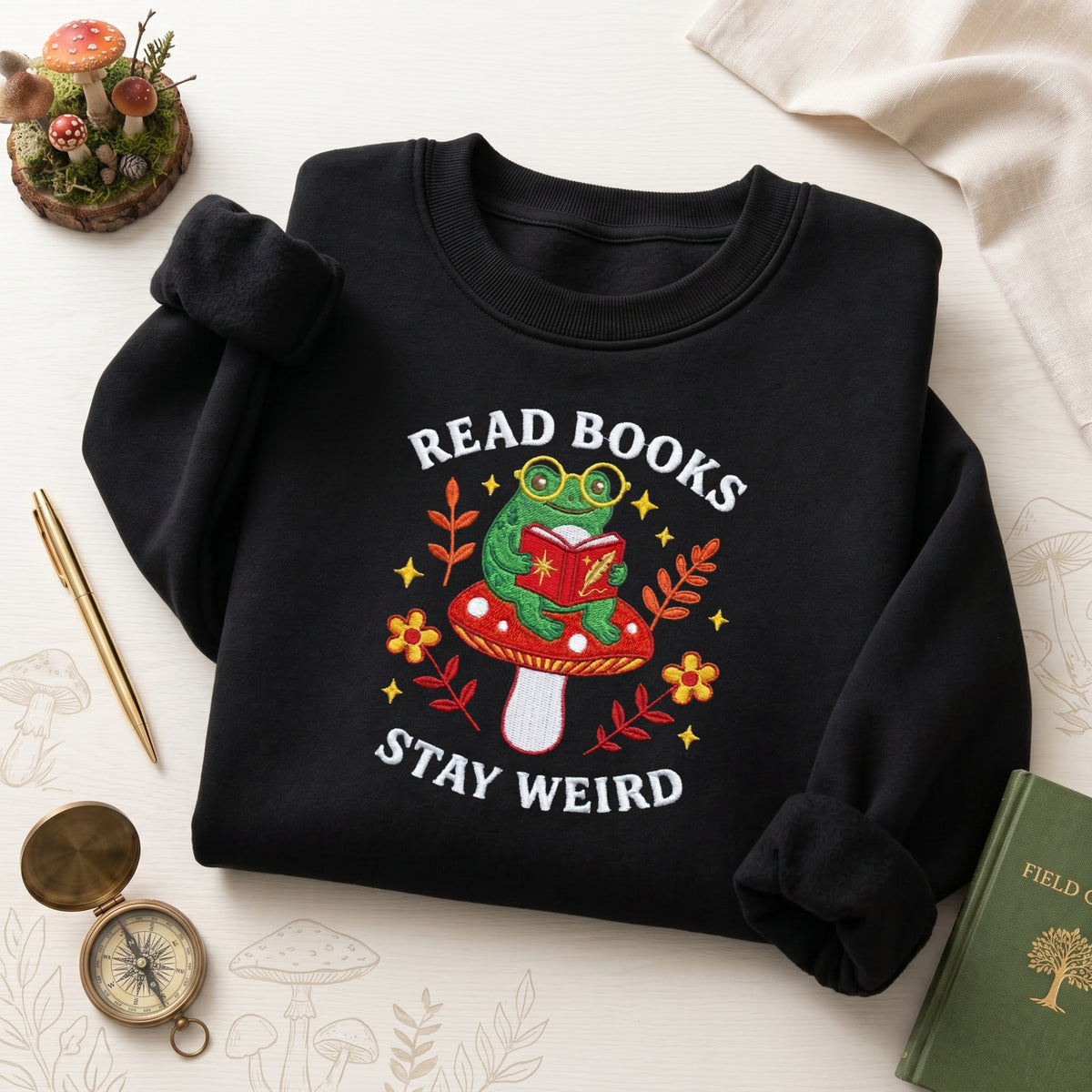 Read Books Stay Weird Frog Mushroom Cottagecore embroidered sweatshirt — front view