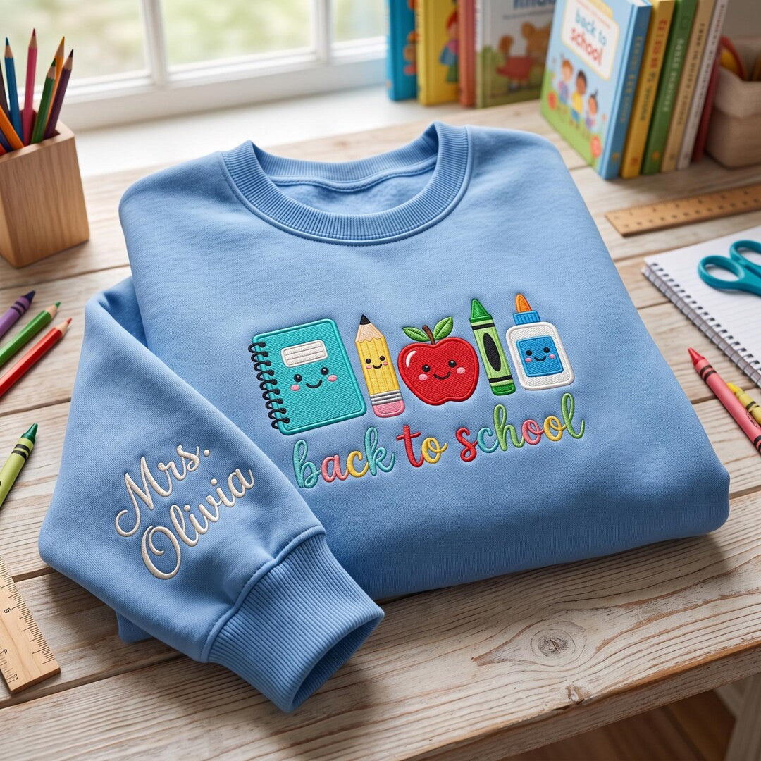 Personalized Teacher to School Supplies Notebook Apple Crayon Glue Custom Name Sleeve embroidered sweatshirt — front view