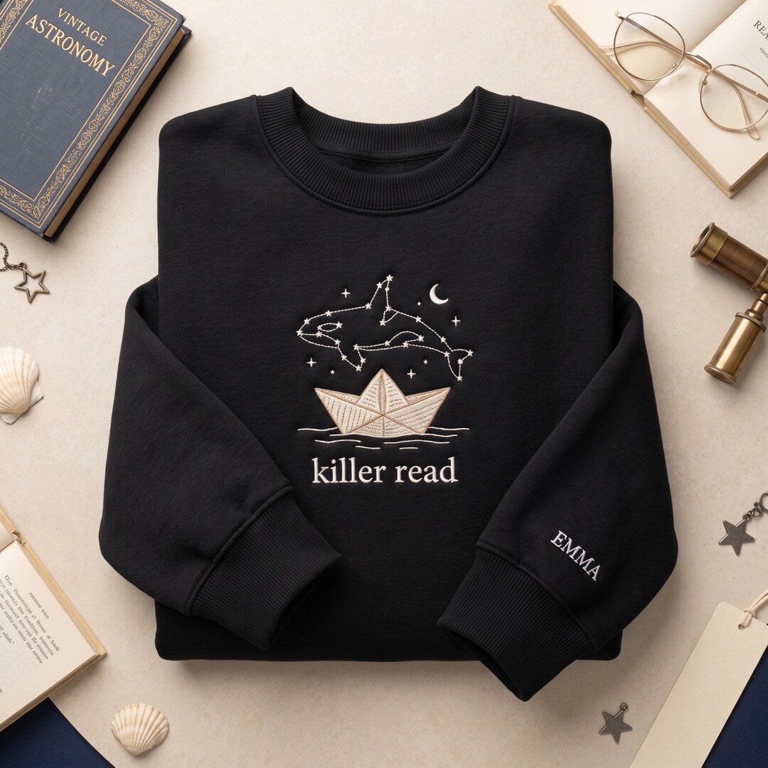 Personalized Orca Constellation Paper Boat Reading Book Lover embroidered sweatshirt — front view