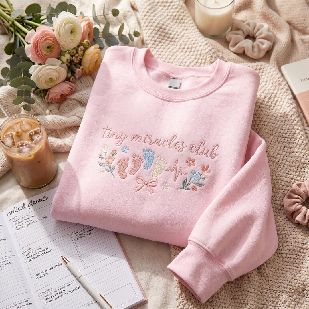 Tiny Miracles Club NICU Labor Delivery Nurse Baby Footprints Floral Heartbeat embroidered sweatshirt — front view