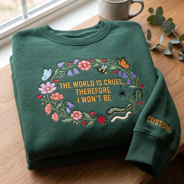 Personalized the World Is Cruel Therefore I Won't Be Floral Wreath Garden Bugs Custom Name Sleeve embroidered sweatshirt — front view