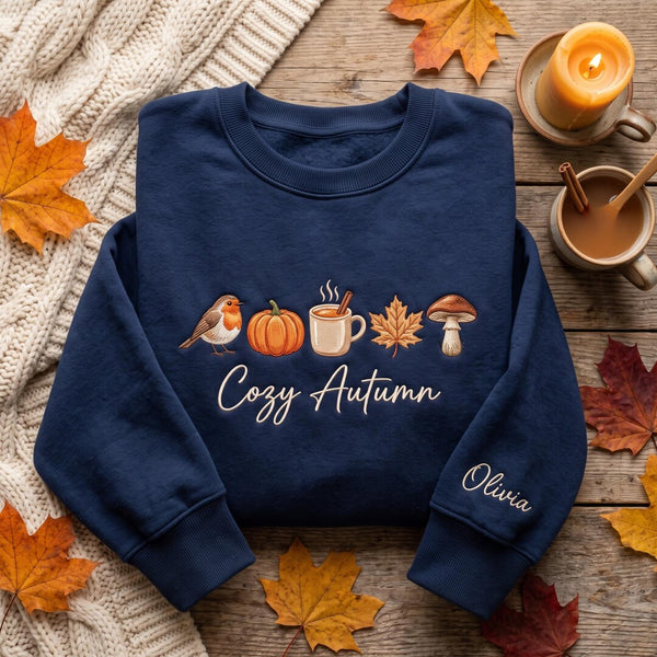 Personalized Cozy Autumn Robin Pumpkin Coffee Maple Leaf Mushroom Custom Name Sleeve embroidered sweatshirt — front view