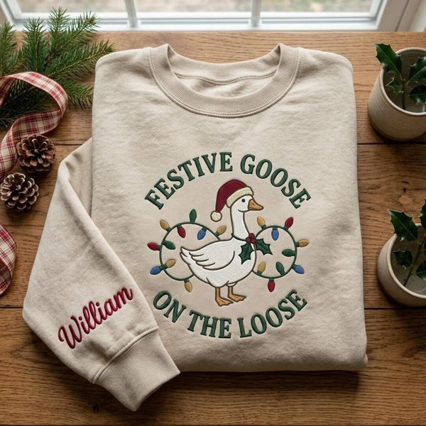Personalized Festive Goose on the Loose Santa Hat Christmas Lights Custom Name embroidered sweatshirt — front view