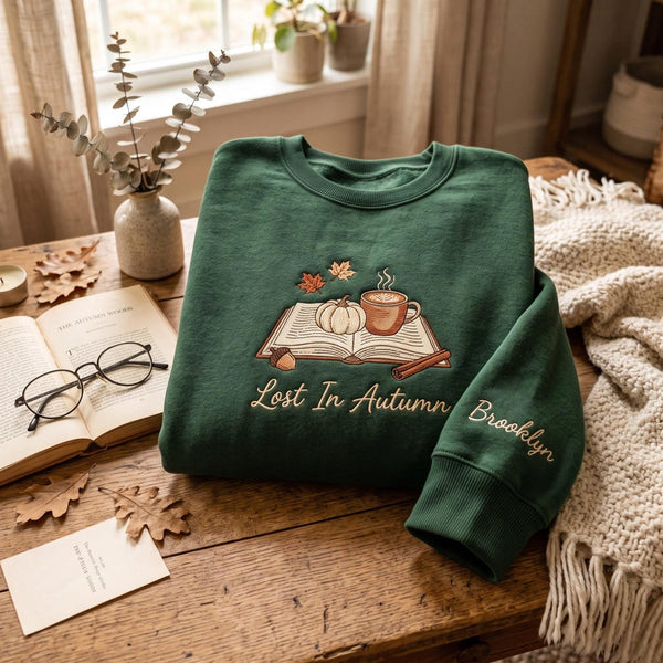 Personalized Fall Book Lover Lost in Autumn Pumpkin Coffee Leaves Custom Name Sleeve embroidered sweatshirt — front view