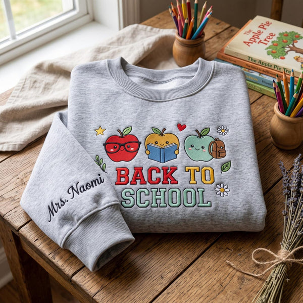Personalized Back To School Cute Apple Trio Teacher Custom Name Sleeve embroidered sweatshirt - front view