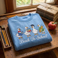 Back To School Goose Quartet Books Pencils Graduation Cap embroidered sweatshirt - front view