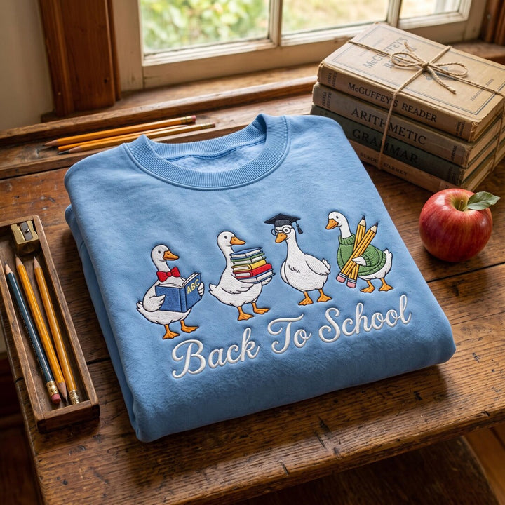 Back To School Goose Quartet Books Pencils Graduation Cap embroidered sweatshirt - front view