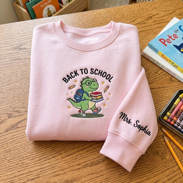 Personalized Back To School Dinosaur Dino Backpack Books Teacher Custom Name Sleeve embroidered sweatshirt - front view