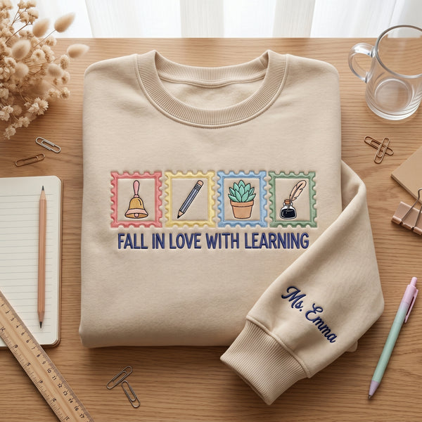 Personalized Fall In Love With Learning Teacher Stamp Icons Sleeve Name embroidered sweatshirt - front view