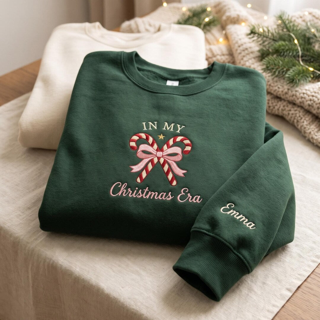 Personalized In My Christmas Era Candy Cane Coquette Bow Custom Name Sleeve embroidered sweatshirt - front view