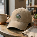 Raccoon Reading Book embroidered hat — front view
