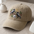 Two Ravens Skull Crescent Moon Botanical Branches Halloween Embroidered Hat — Washed Hat