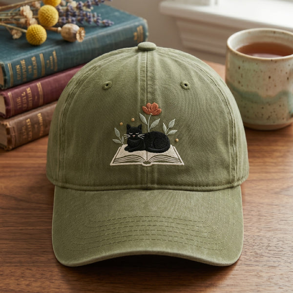 Black Cat Sleeping on Open Book Wildflowers Embroidered Hat — Washed Hat