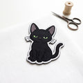Black Cat Sitting embroidered patch in 3" — front view