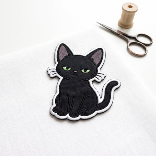 Black Cat Sitting embroidered patch in 3" — front view