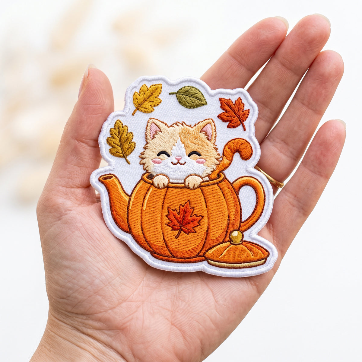 Cat in Pumpkin Teapot Autumn Leaves embroidered patch in 3" — front view