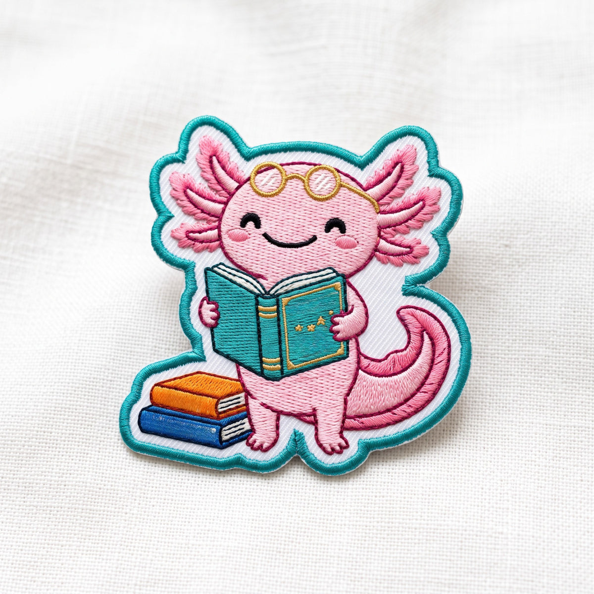 Axolotl Reading Books Glasses embroidered patch — front view