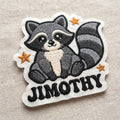 Jimothy Raccoon embroidered patch in 3" — front view