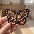 Celestial Moth Butterfly Moon Stars Flames Botanical embroidered iron on patch — front view