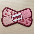 Books Bandage Crossover Heart Lover Iron On Embroidered Patch — Iron-on patch
