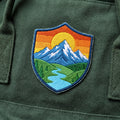 Mountain Sunset River Valley Landscape Shield Iron On Embroidered Patch — Iron-on patch