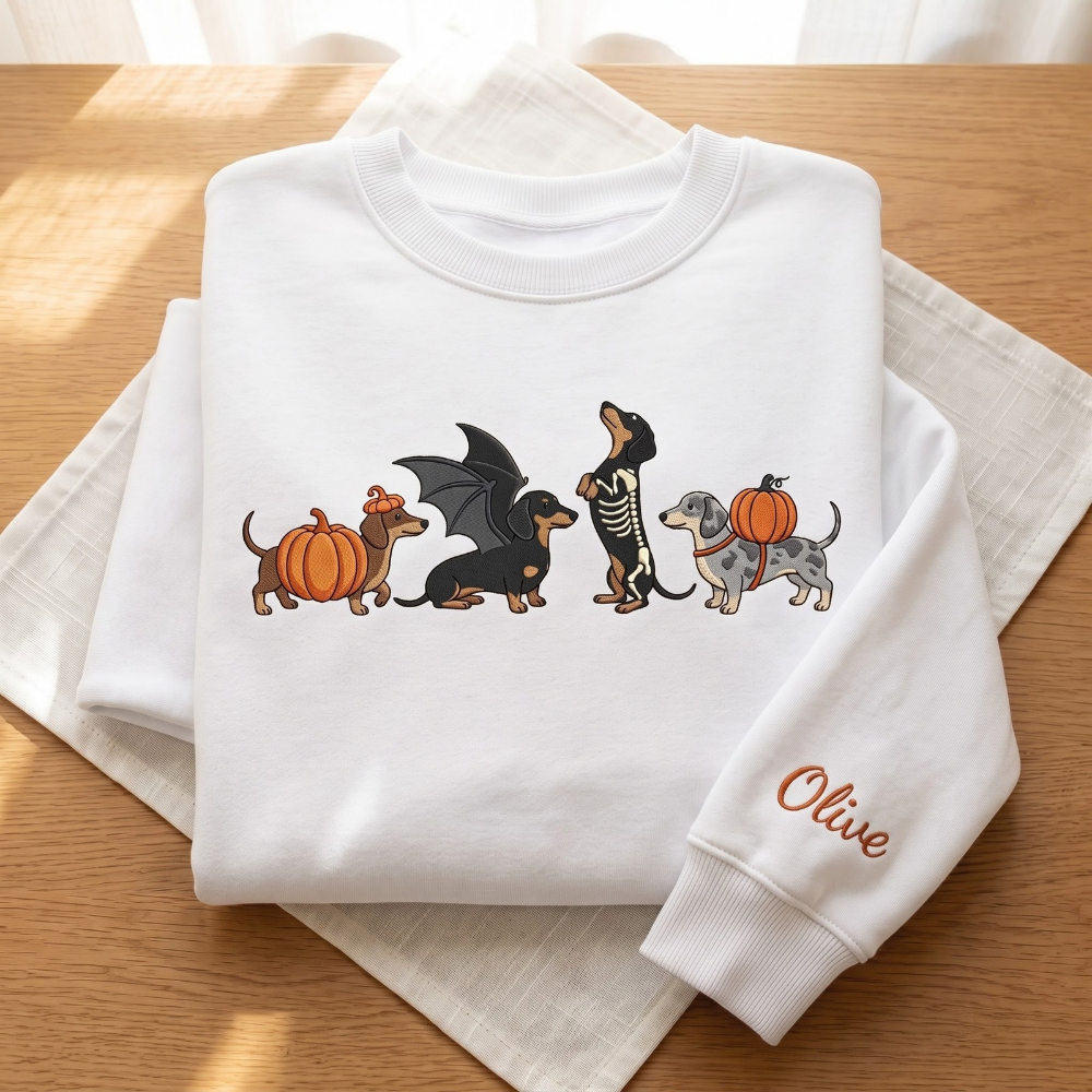 Personalized Halloween Dachshund Costumes Pumpkin Bat Wings Skeleton embroidered sweatshirt — front view
